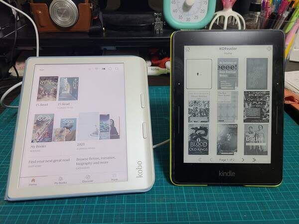 A white Kobo Libra Colour on the left and my Kindle Voyage on the right
