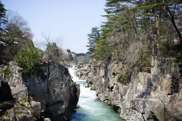 River snaking through a rocky gorge with trees on either side.