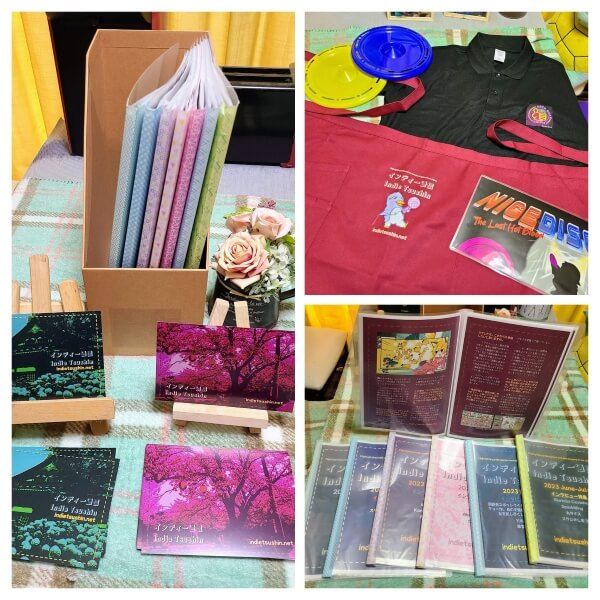 Collage of three pictures. 1. Indie Tsushin postcards spread out in front of a box of zines 2. Nice Gear Games polo shirt, Indie Tsushin apron, Nice Disc poster, and two flying discs 3. Indie Tsushin zines spread out on a table with one held open behind them