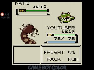 YOUTUBER facing off against a Natu, which is green and painted like a totem pole animal