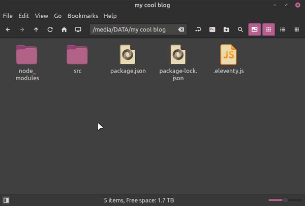 Folder "my cool blog" now has a subdirectory "src" and a new ".eleventy.js" file